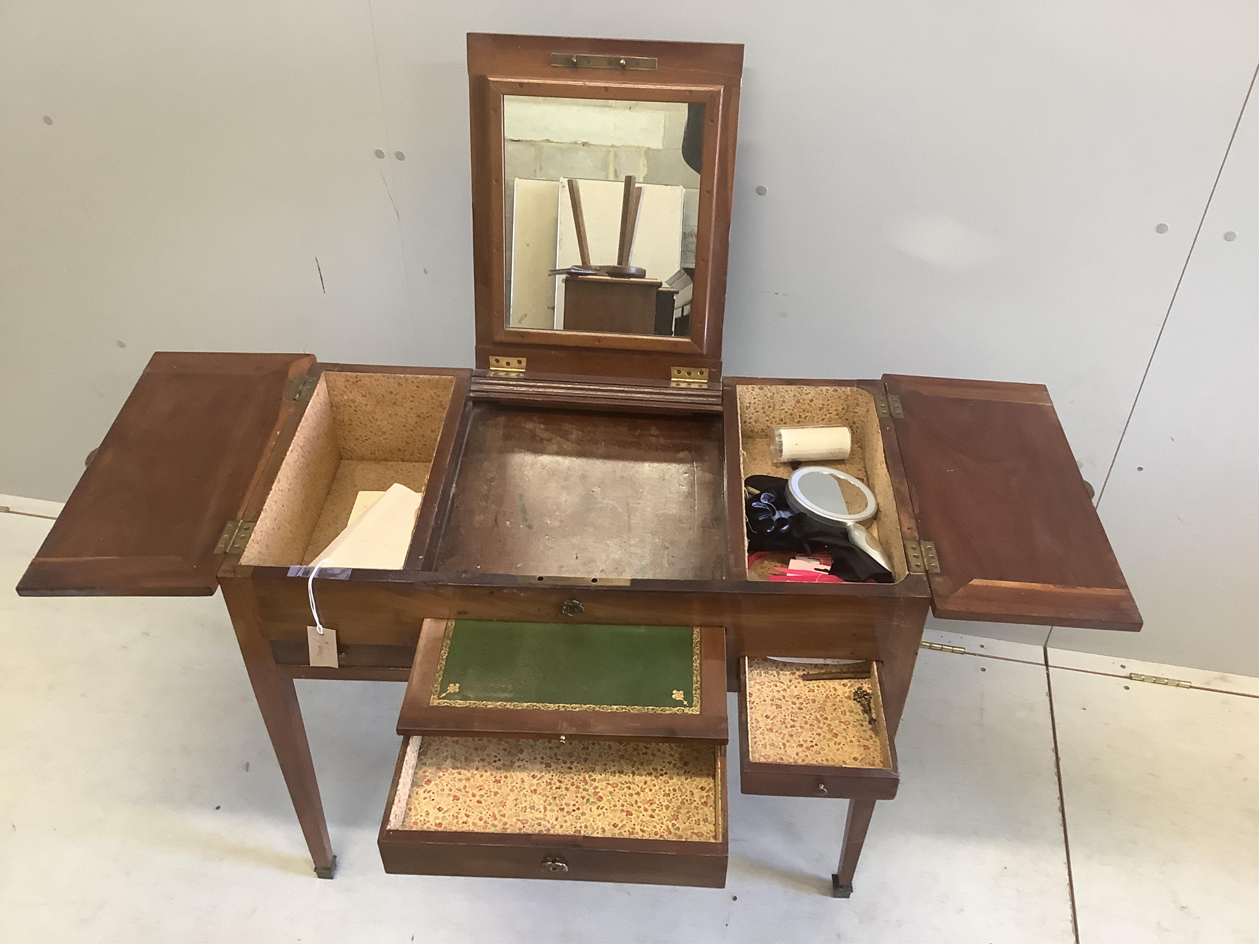 A 19th century Continental mahogany enclosed dressing table, width 86cm, depth 49cm, height 71cm. Condition - fair